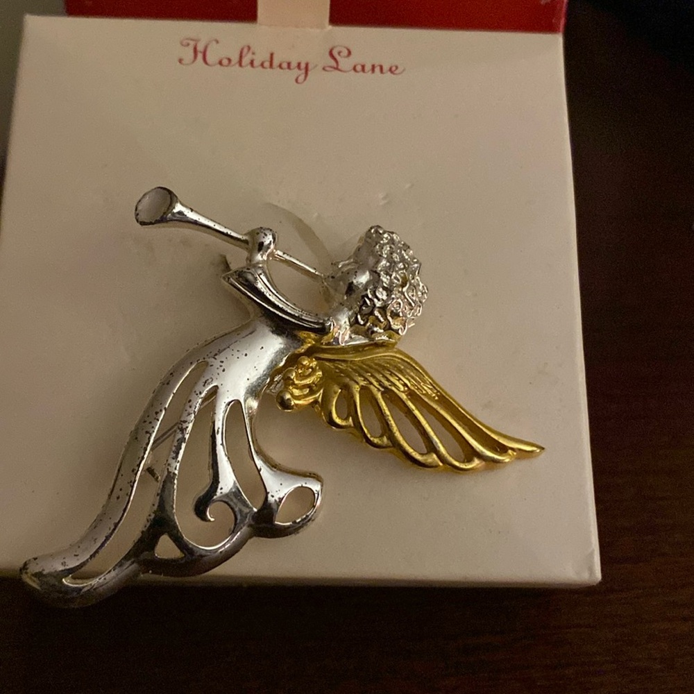 Silver and gold plated angel with horn
